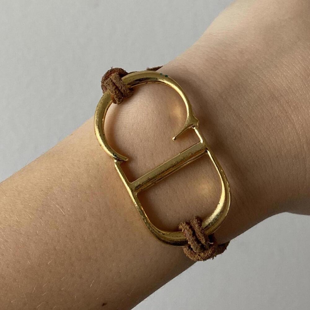 Dior Gold Tone Logo Bracelet with Brown Suede Cord